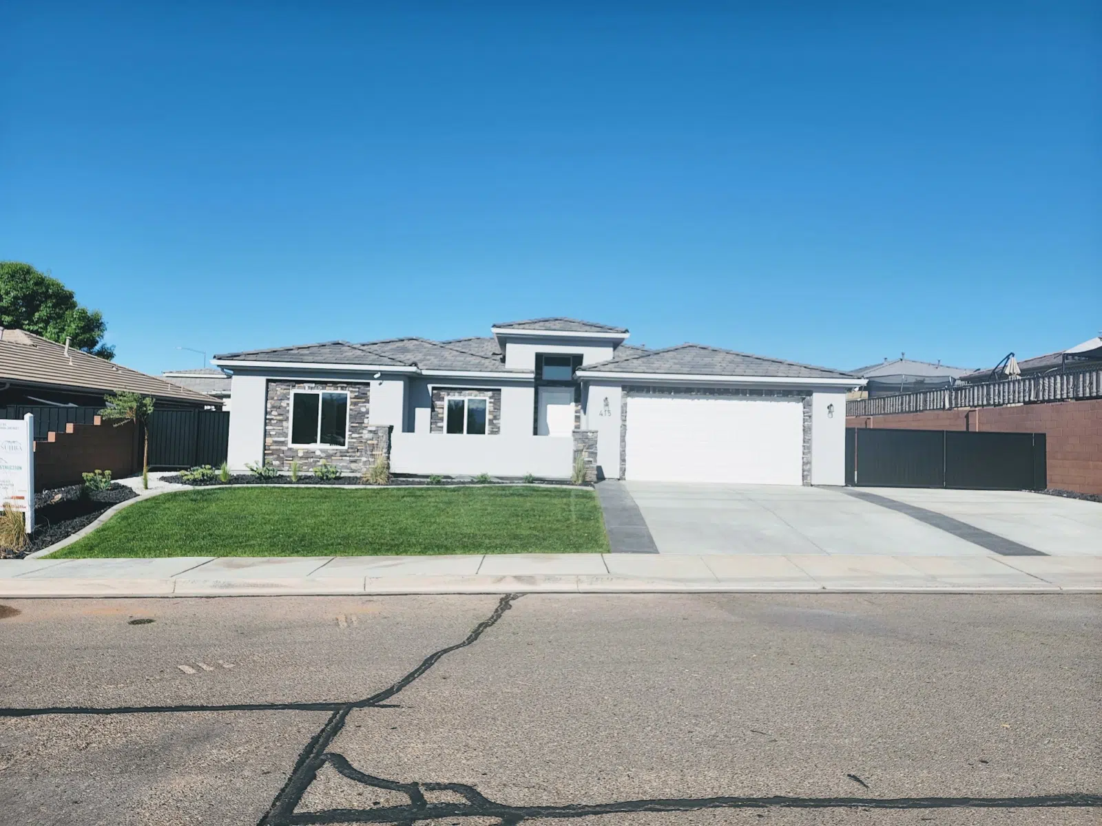 New sod lawn at a modern white stucco home — Cutting Edge Lawn Care in Washington