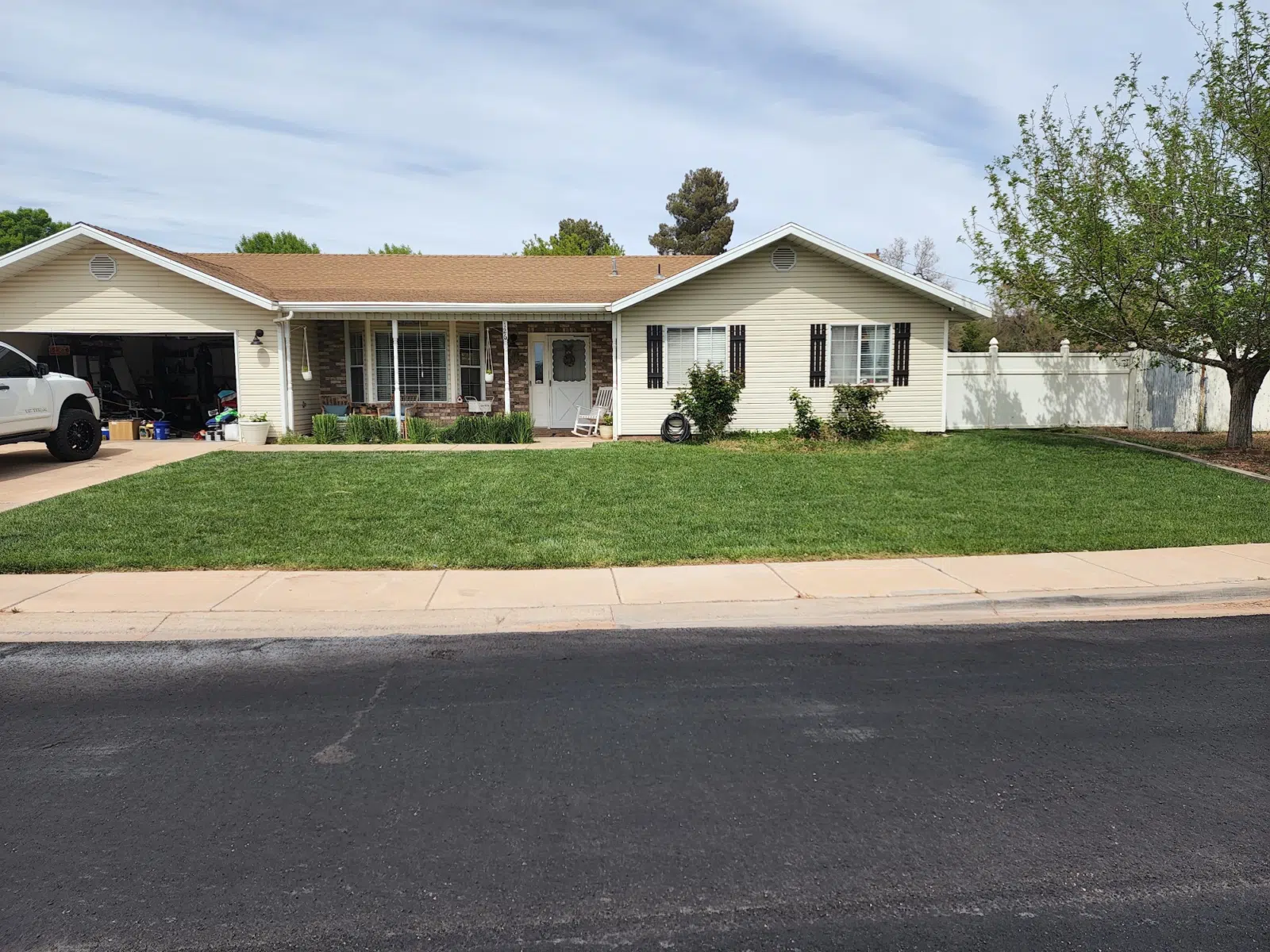 Mowed front yard of a single-story ranch home — Cutting Edge Lawn Care in Washington